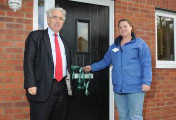 Robert Napier with our tenant cutting the ribbon